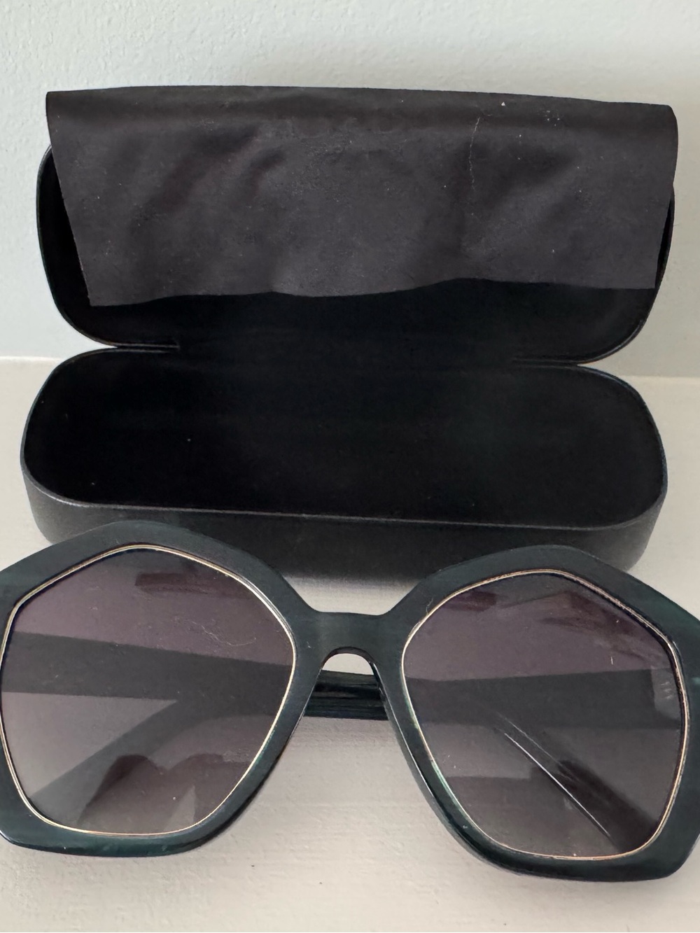Green plastic sunglass with large lenses